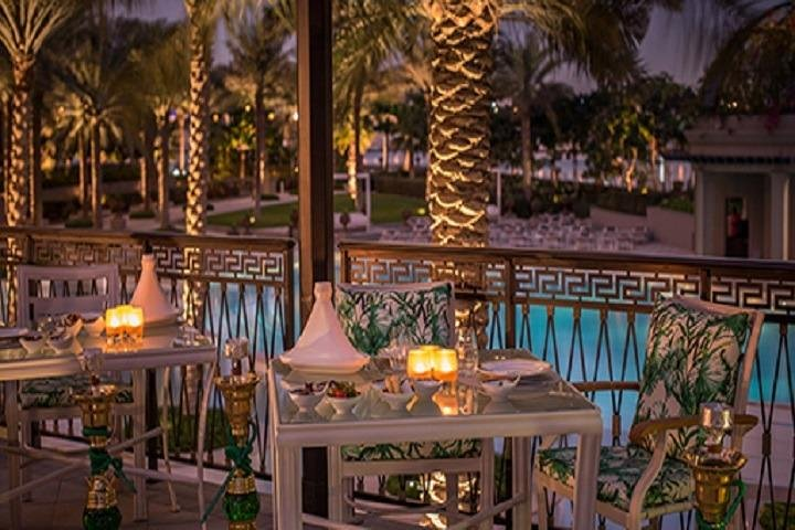 Savor a delightful buffet dinner amidst exquisite decor and lush palm trees where culinary creations come alive at live cooking stations in the stunning Palazzo Versace Dubai.